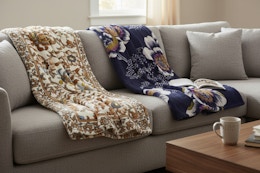 two vera bradley throw blankets on a couch