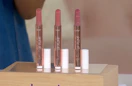three tube of lipstick on a display