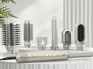 a silver hot air styler set on a table