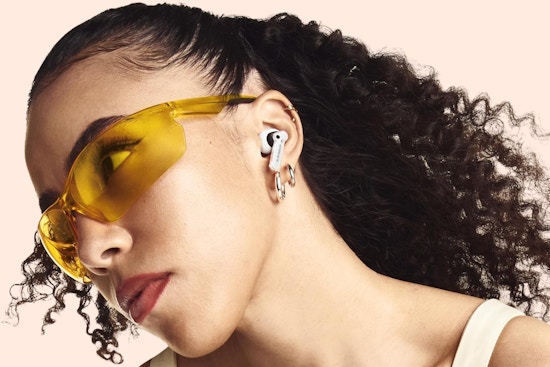 a woman wearing earbuds