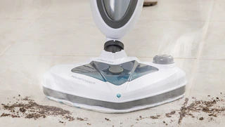 a steam mop cleaning a floor