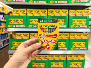 hand holding crayola crayons at walmart