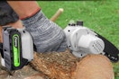 Person using the CEEPUY Mini Chainsaw Cordless 6 Inch on a log.