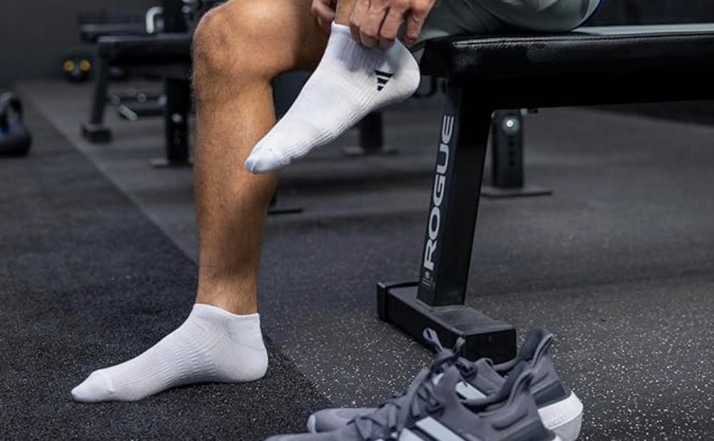 a person putting on socks 