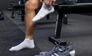 a person putting on socks 