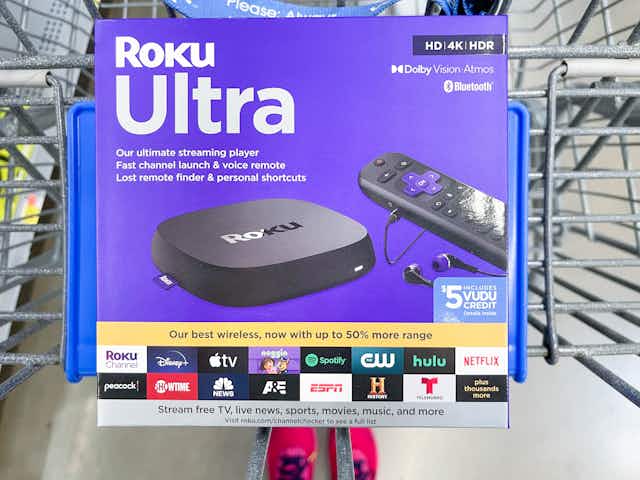 A box for Roku Ultra sitting on a Walmart shopping cart.