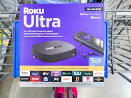 A box for Roku Ultra sitting on a Walmart shopping cart.