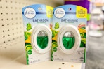 febreze bathroom air fresheners on a shelf