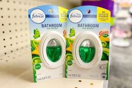 febreze bathroom air fresheners on a shelf