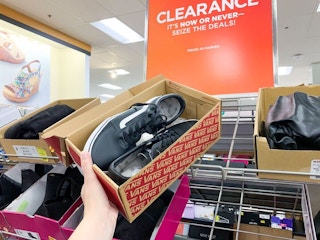 someone holding vans in stores