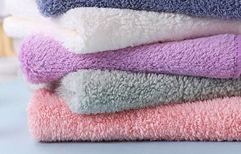 a stack of colorful dishcloths