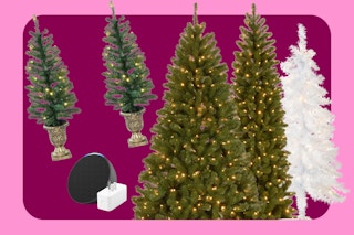 a woman looking at artificial trees in hobby lobby