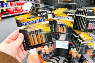 hand holding AA batteries at CVS