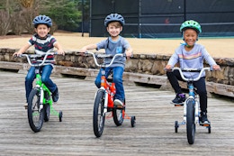 Lifestyle image of 3 children on Dynacraft bikes outside
