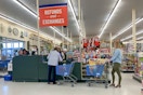 People in line at the Refunds and Exchanges checkout register.