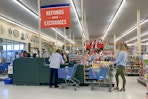 People in line at the Refunds and Exchanges checkout register.