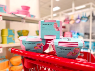 tupperware bowls and canister sets sitting on a target cart