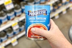 hand holding a can of progresso soup