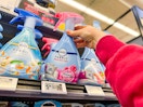 hand grabbing a bottle of Febreze fabric spray