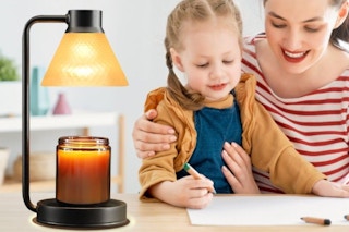 family working next to candle lamp wamer