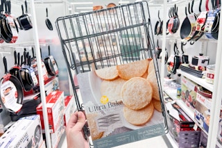 hand holding a wilton 3 tier cooling rack set at target