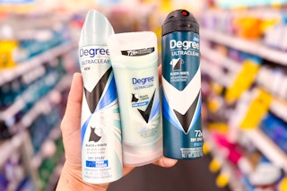 hand holding three degree deodorants in a store aisle