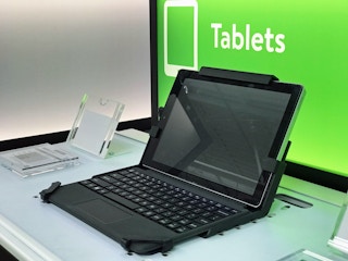 A tablet on a tablet in front of a sign that says Tablets at Walmart