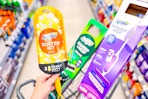 swiffer duster kit, deluxe sweep kit, and power mop in a cart