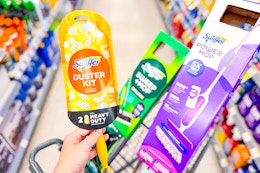 swiffer duster kit, deluxe sweep kit, and power mop in a cart