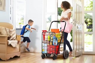 Kyspho Shopping Cart being used by a woman walking into her home (for storing groceries)
