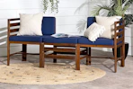 Lifestyle image of the Walker Edison Modern Acacia Patio Sofa Set in navy