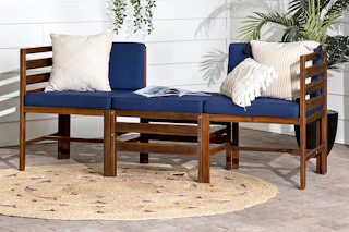 Lifestyle image of the Walker Edison Modern Acacia Patio Sofa Set in navy