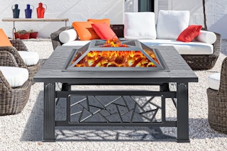Segmart Wood Burning Fire Pit: lifestyle image of it used outdoors