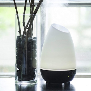 An essential oil diffuser on a table.