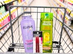 garnier and loreal shampoo, with maybelline brow duo in a walgreens cart