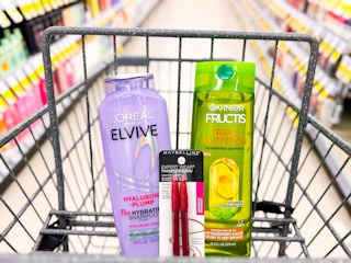 garnier and loreal shampoo, with maybelline brow duo in a walgreens cart