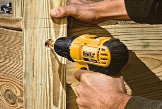 person using a dewalt drill