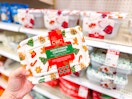 hand holding a cwc holiday food storage set in front of a target shelf