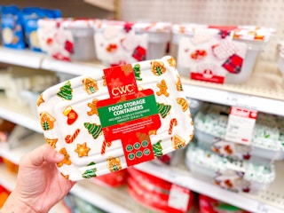 hand holding a cwc holiday food storage set in front of a target shelf