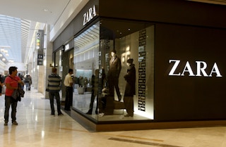 A Zara store entrance inside of a mall.
