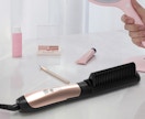 a hair straightener brush on a counter