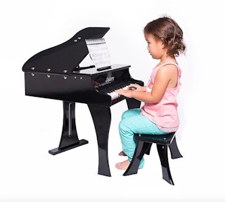 child playing a piano