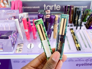 hand holding Tarte lash products
