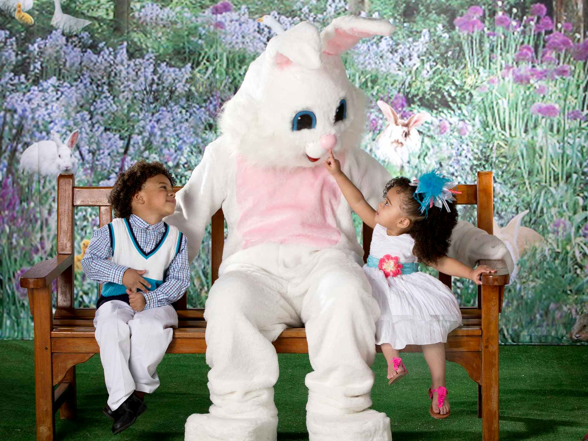 young children taking a photo with the easter bunny at bass pro shops