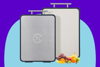 Tibbicc Titanium Cutting Board on a blue background.