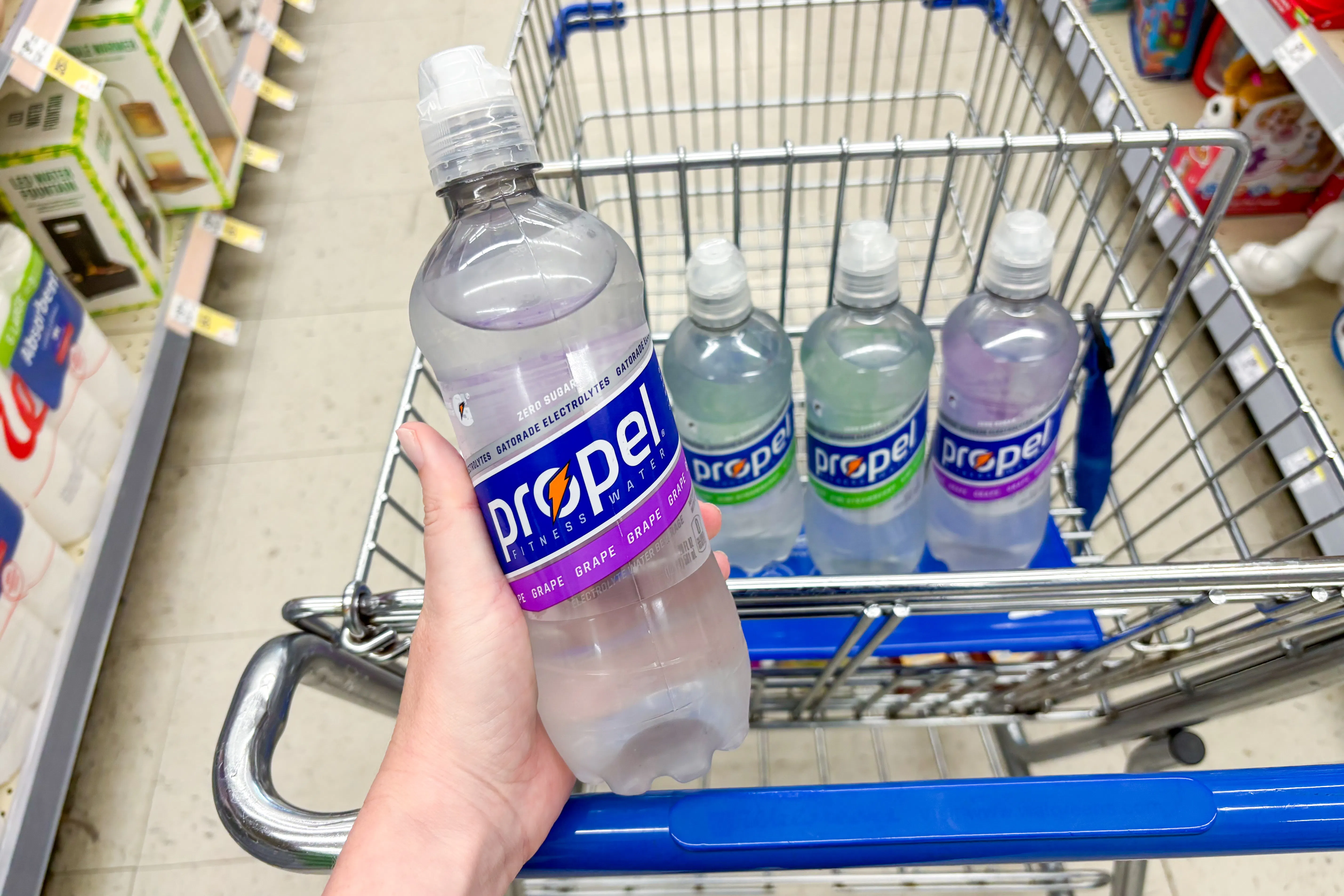 Four bottles of Propel Water on a Walgreens counter, highlighting the special price