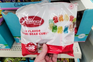 hand holding albanese gummy bears at dollar tree