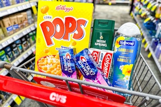 kelloggs cereal, crest and colgate toothpastes, and body washes in a cart