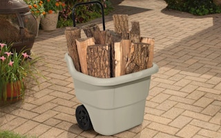 tan utility cart holding wood logs
