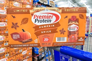 a box of pumpkin spice premier protein drinks on a cart